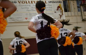 Husaynu (center) performs with the Mercy Pompon team.