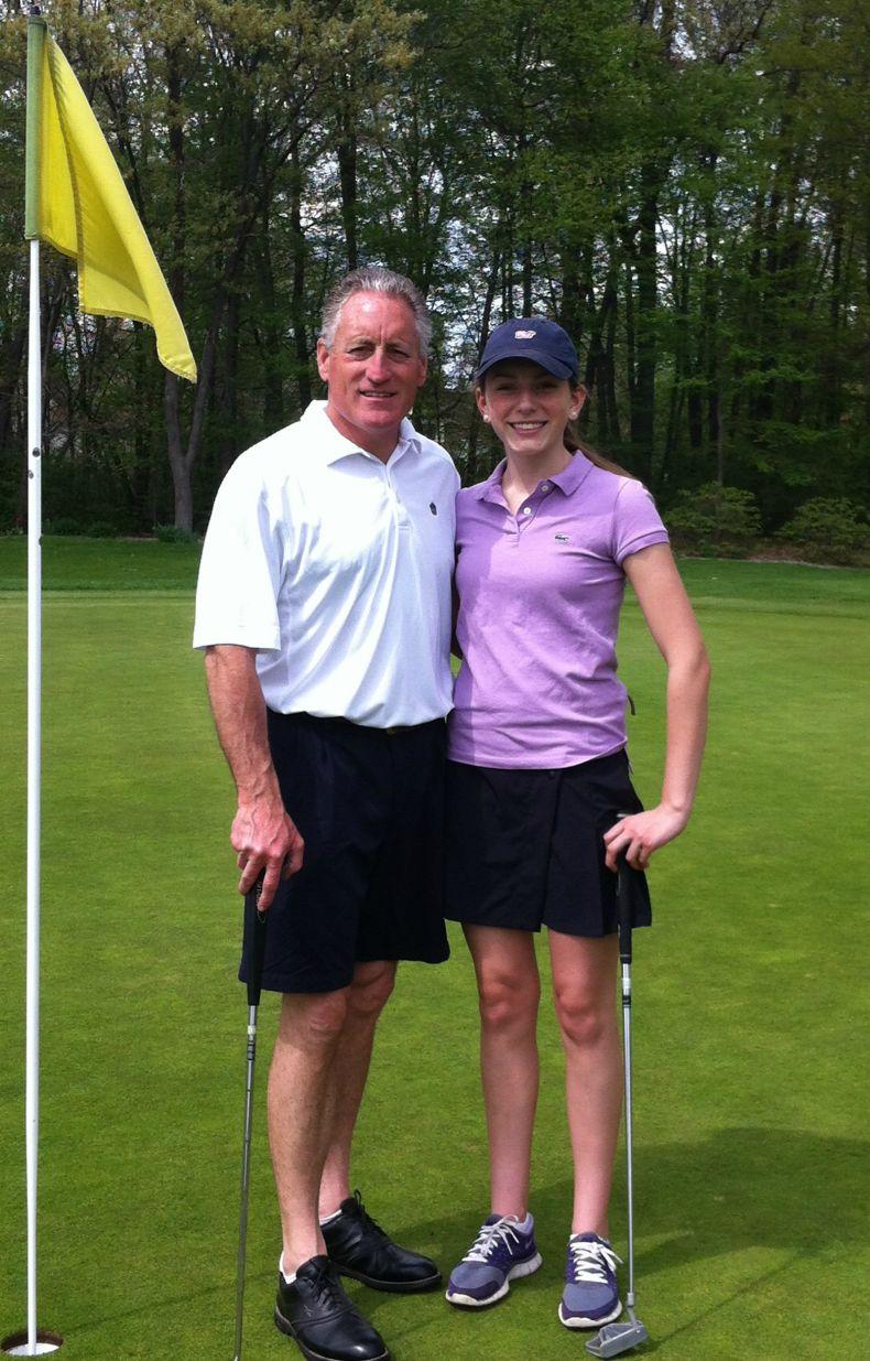 Caption: Sophomore Jenny O'Brien and her dad pose after putting on the last green at the Father Daughter Golf Outing.  Photo Credit: Jenny O'Brien