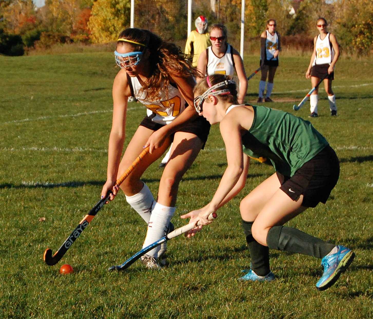 Junior, Maria Pulice, battles to get the ball away from Huron so they do not score a goal.
