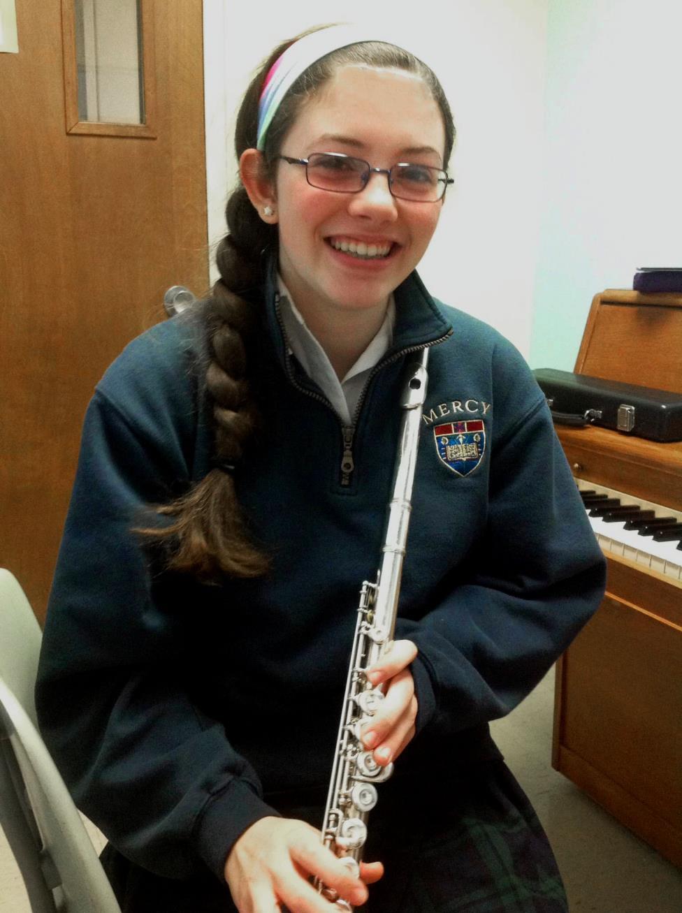 Elise Scarchilli is immersed in music; she plays flute in Mercy's orchestra and in the Royal Oak High School marching band, competes in music festivals, and is an avid pianist.
